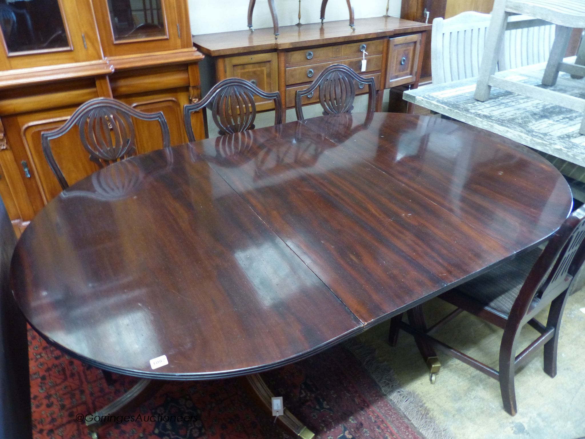 A mahogany two-pedestal dining table (one additional leaf) 186cm extended, width 114cm, height 71cm